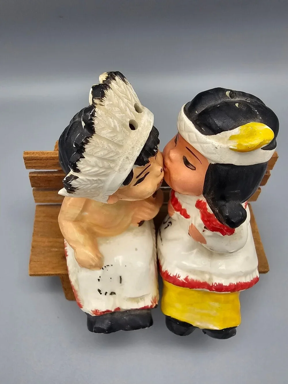 Vintage Ceramic Native American Couple Salt and Pepper Shakers on Wooden Bench